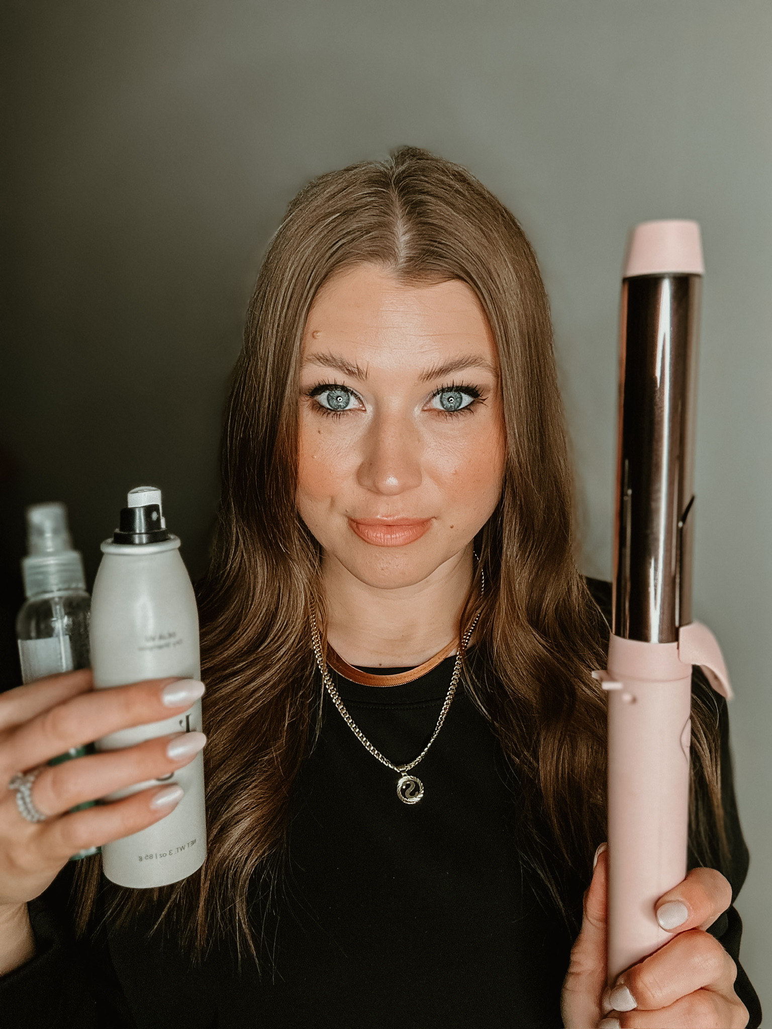 Savannah Kreger holding L’ange hair products and L’ange curling iron, must-have L’ange hair care, best L’ange styling tools, shiny healthy hair, voluminous curls, heat styling essentials, L’ange hairspray, salon-quality hairstyles at home, L'ange Thermal Magique Heat and Humidity Tamer, long-lasting curls