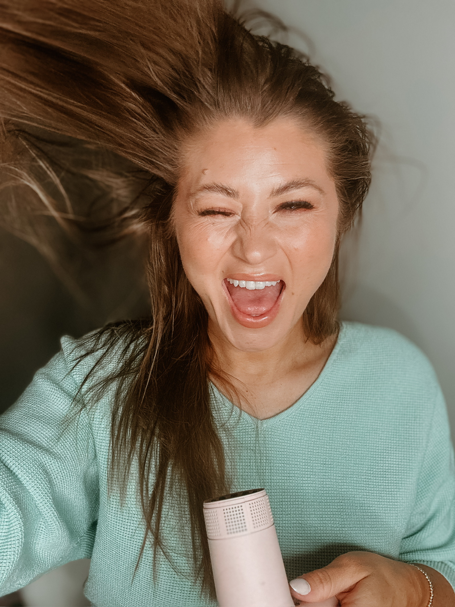 Savannah Kreger blow drying hair after applying L’ange Sorbet Botanical Smoothing Balm, shiny smooth strands, frizz control, healthy blowout, must-have L’ange hair products, best L’ange styling tools, everyday hair care, salon-quality results at home, soft manageable hair