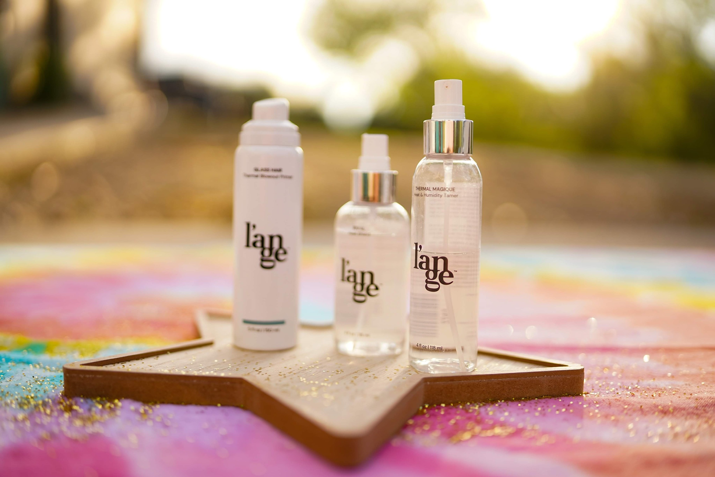 L’ange hair products on display, L’ange Thermal Magique Heat and Humidity Tamer, L’ange Rival Heat Shield, L’ange Thermal Blowout Primer, must-have L’ange favorites, best heat protectant sprays, everyday hair care, shiny healthy hair, salon-quality styling essentials, top L’ange products for frizz control and volume