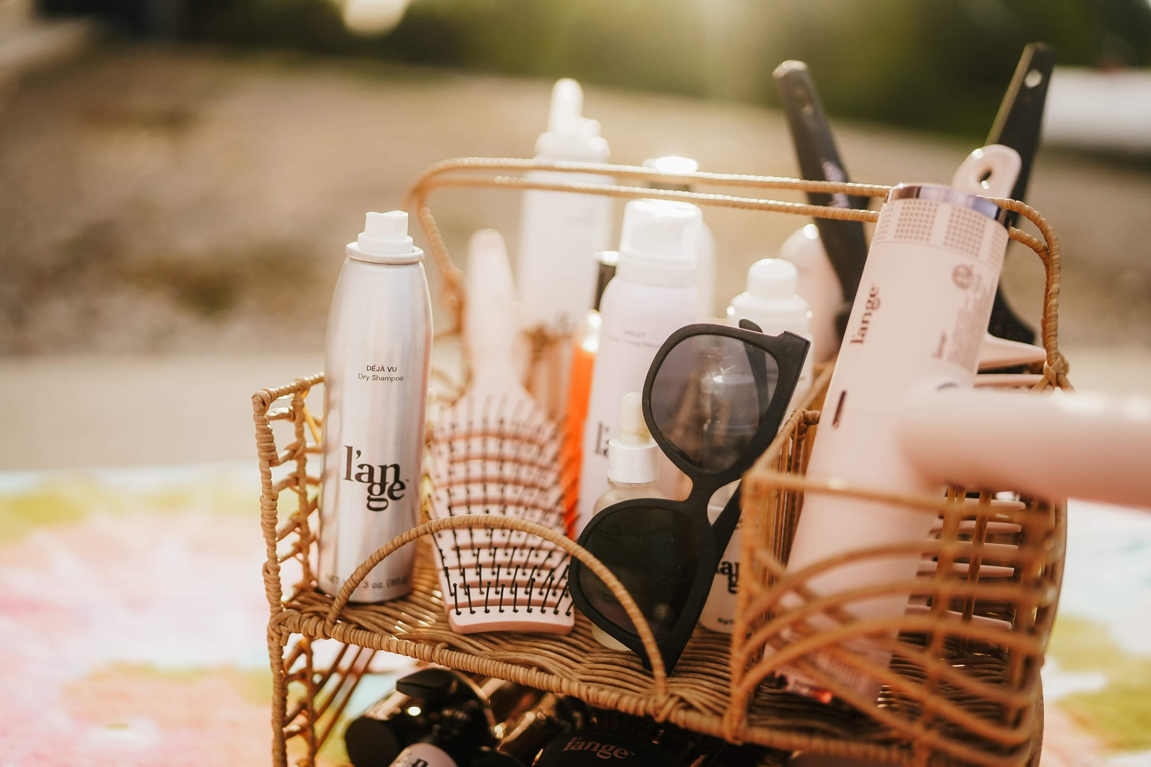 L’ange Déjà Vu Dry Shampoo and styling tools in basket, must-have L’ange hair products, best dry shampoo for volume and freshness, everyday hair care essentials, shiny healthy strands, salon-quality styling at home, L’ange blow dryer, L’ange brushes, top L’ange favorites for effortless beauty routine