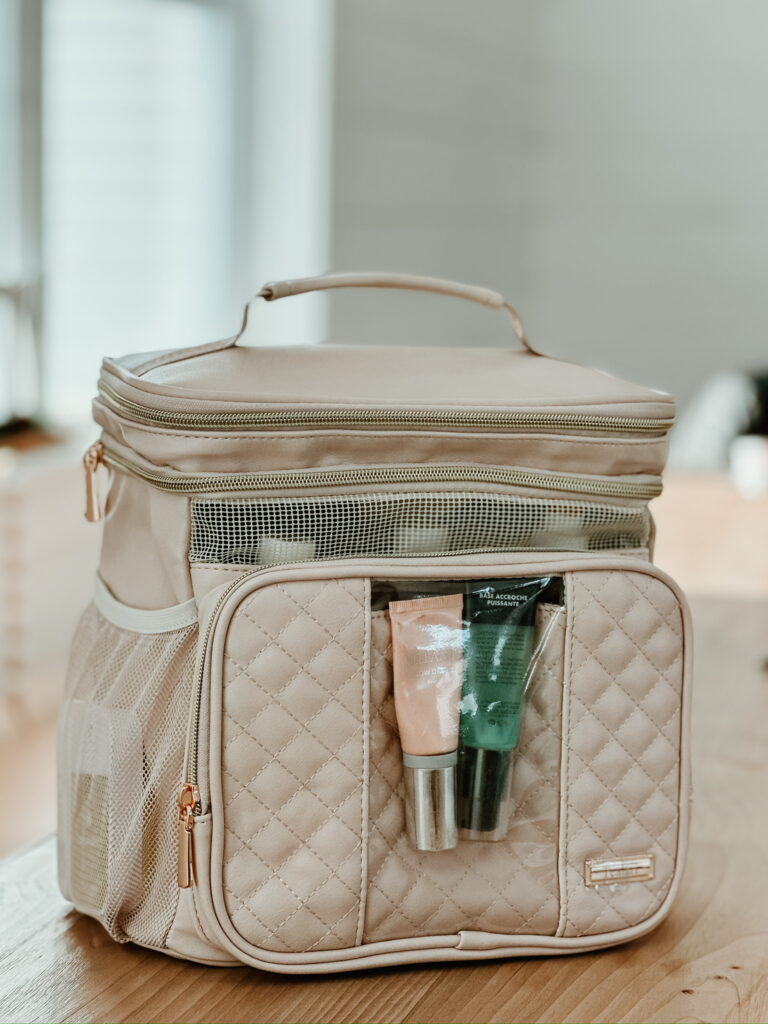 thesavannahk showcasing beige quilted cosmetic bag with skincare products, organized travel makeup and skincare storage solution