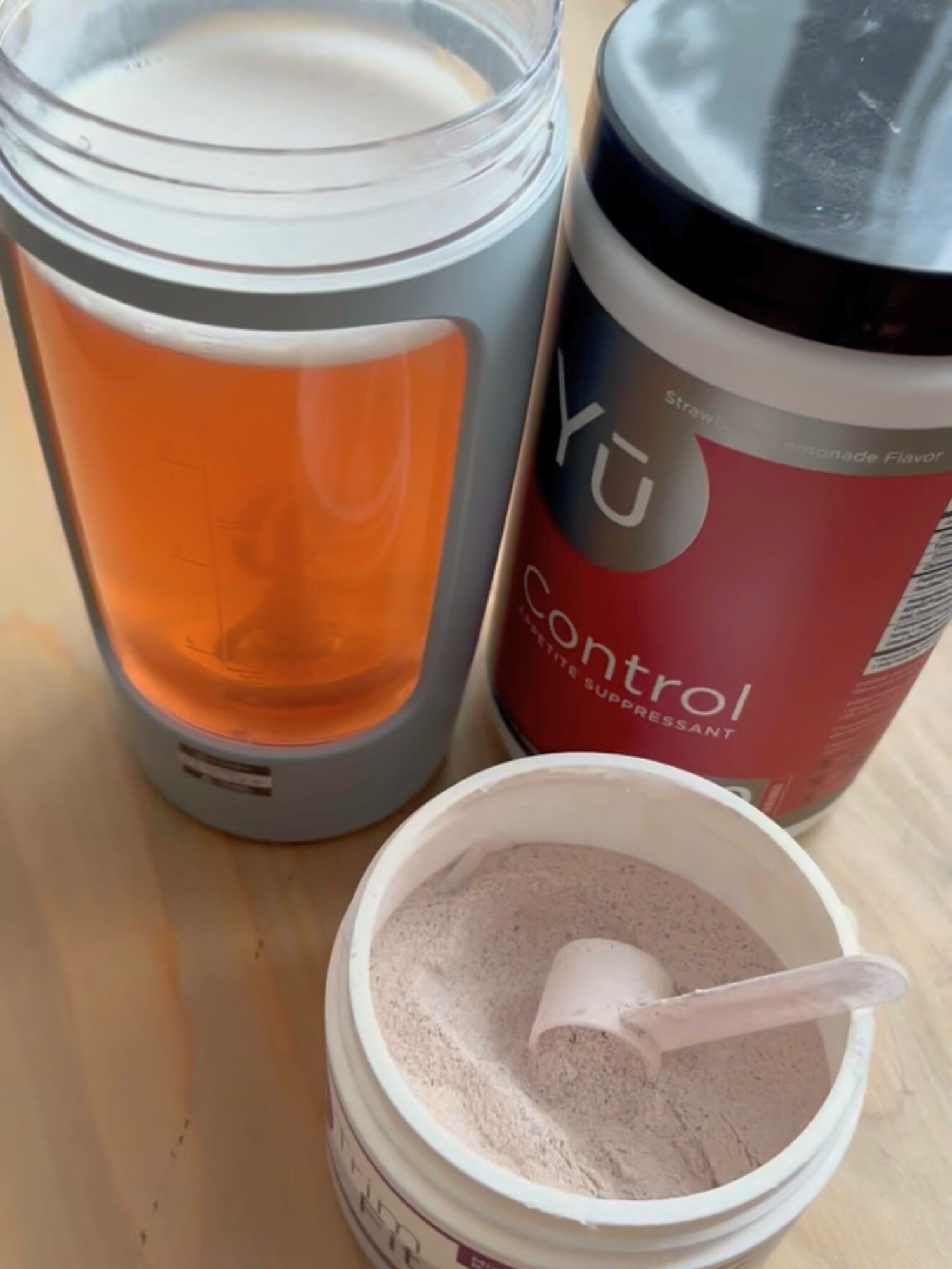 Yū Nutrition Control supplement mixed in a shaker bottle, part of a busy mom metabolism support and sustainable weight loss wellness routine.